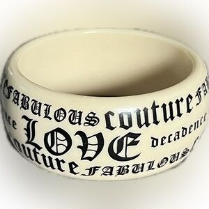 Juicy Couture
"Fabulous Couture Love Decadence" bangle bracelet.